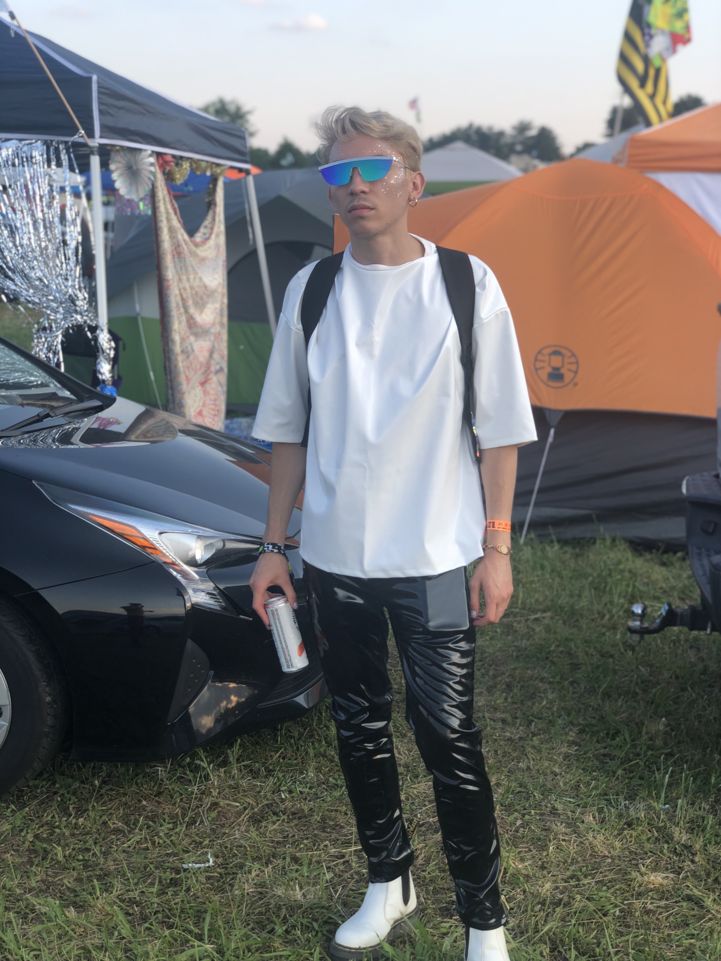 Stephen wearing black vinyl pants and white vinyl top